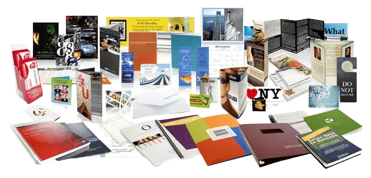 A variety of brochures and flyers are displayed on a table.