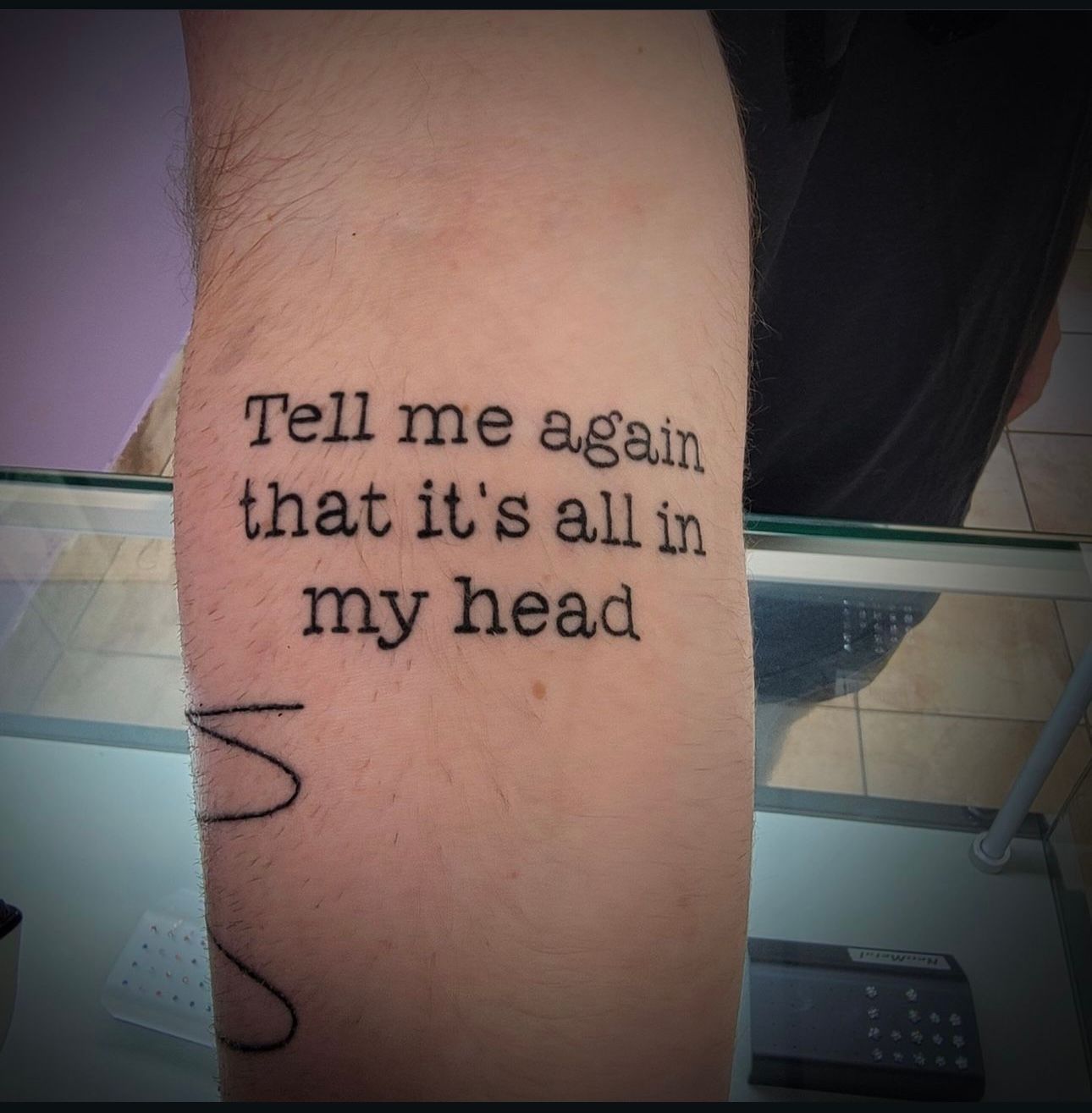 A tattoo that says tell me again that it 's all in my head