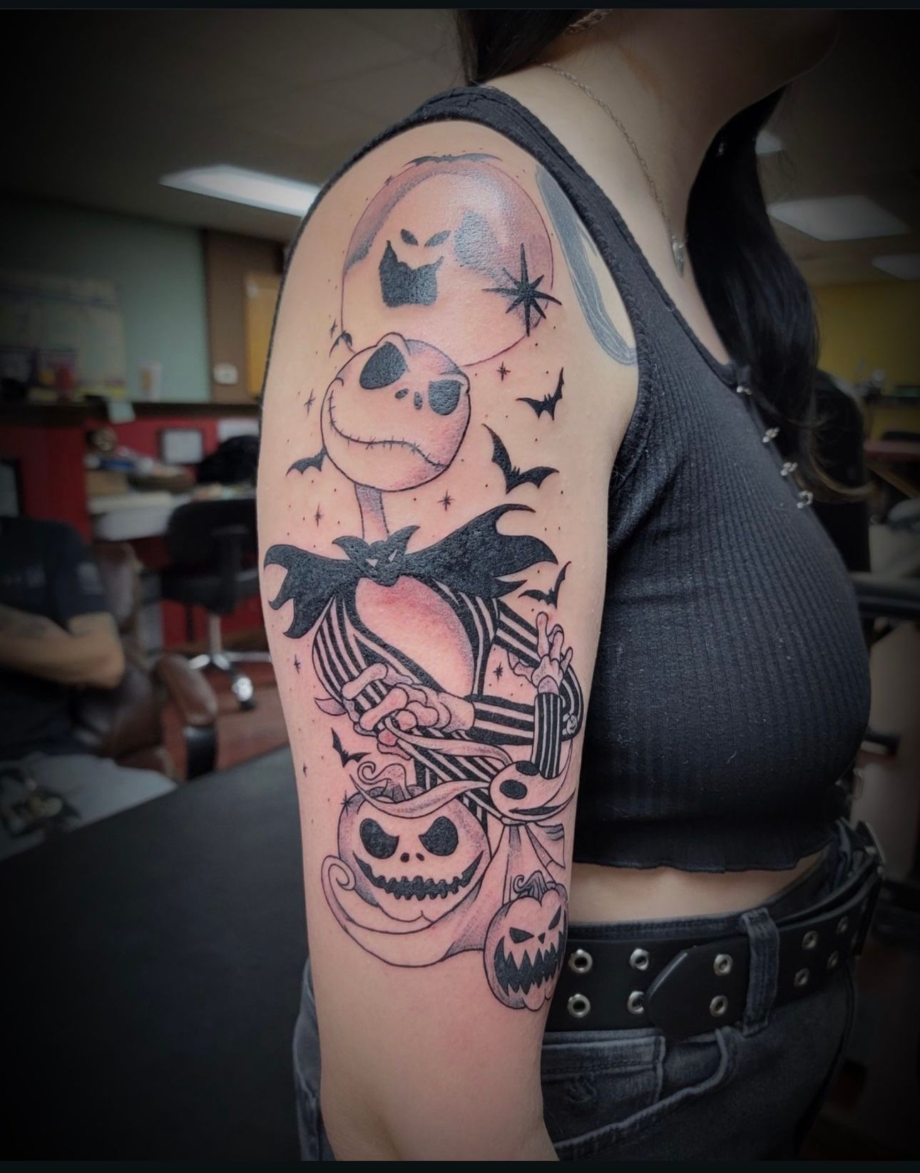 A woman has a nightmare before christmas tattoo on her arm