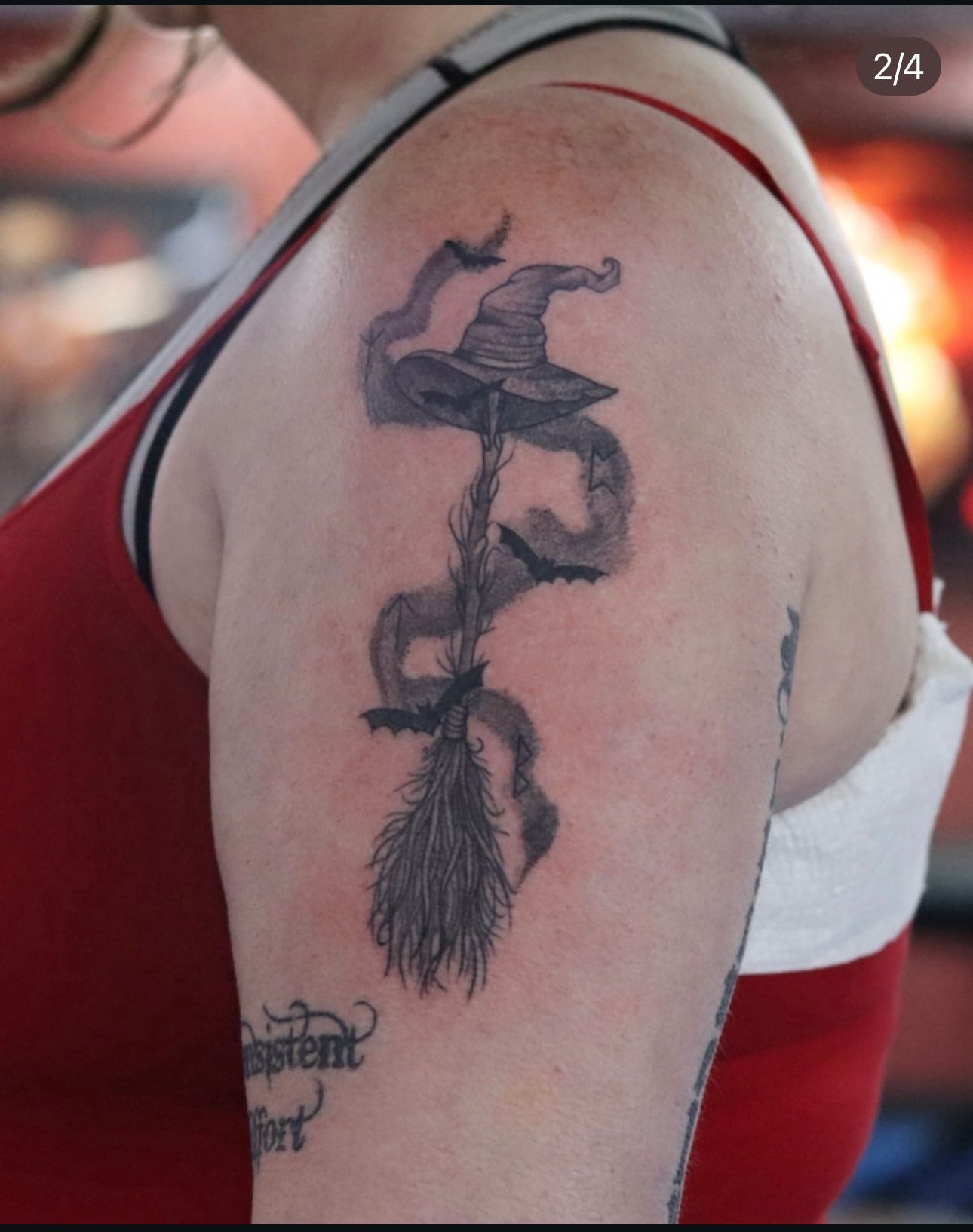 A woman has a tattoo of a witch on her arm