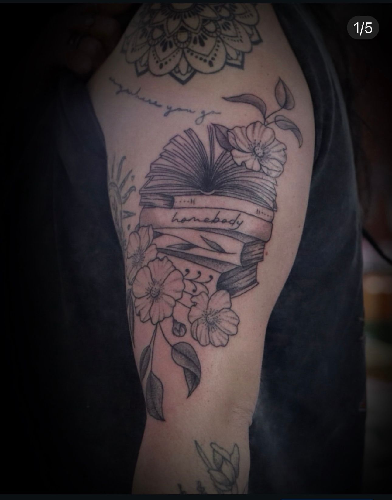 A tattoo on a person 's arm that says i love you