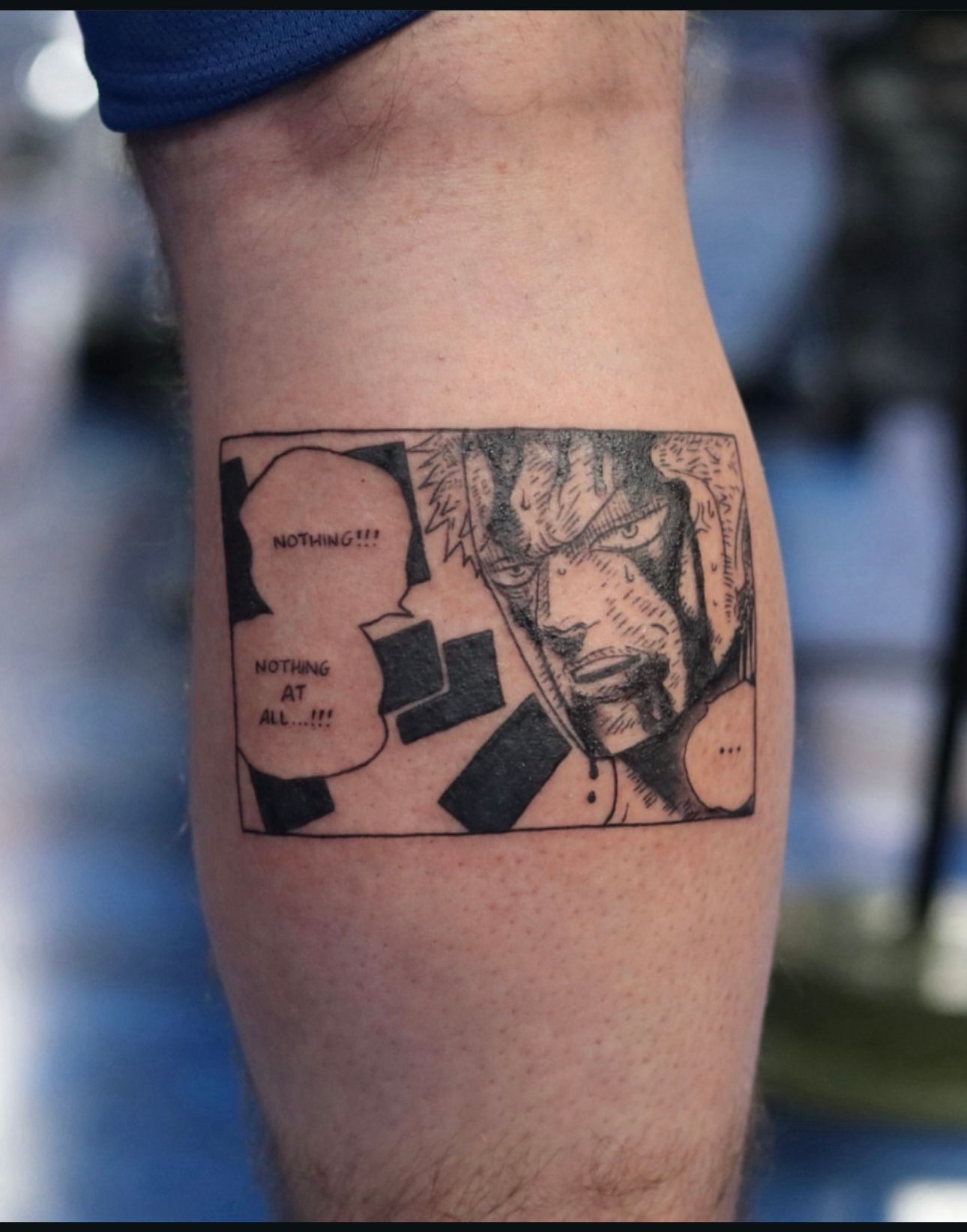 A man has a tattoo of a comic strip on his leg