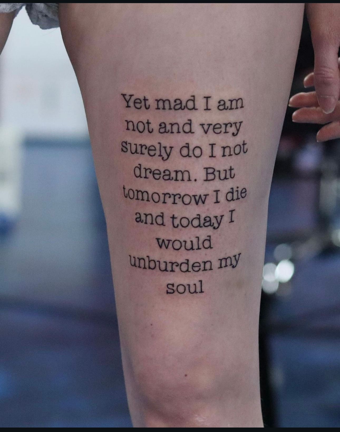 A tattoo on a leg that says yet mad i am not and very surely do i not dream