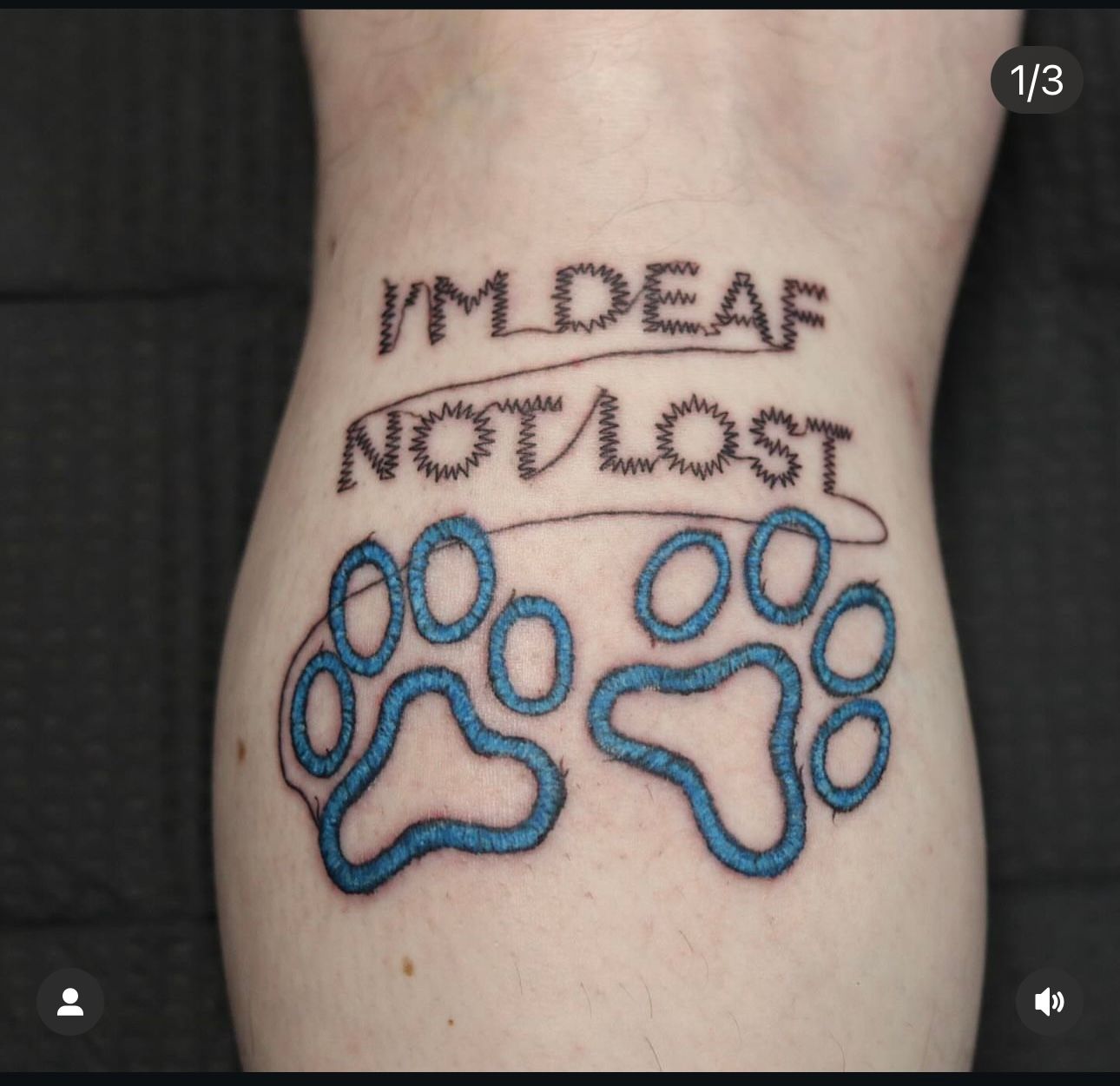 A tattoo on a person 's leg that says i 'm deaf not lost