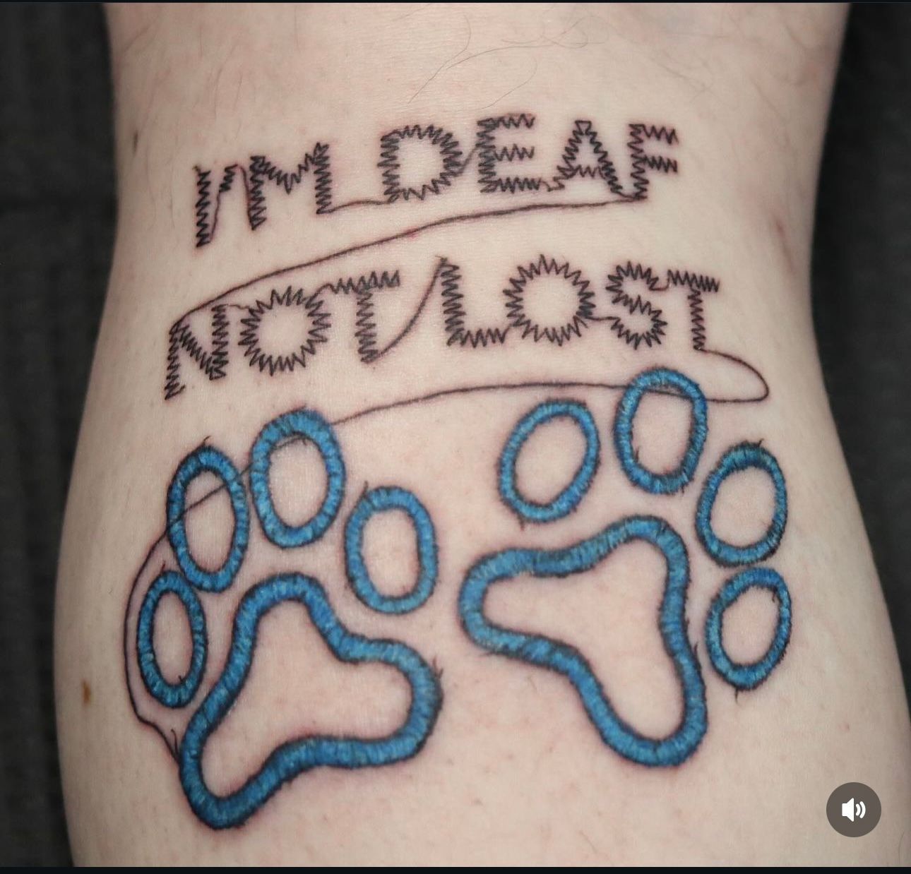 A person has a tattoo that says i 'm deaf not lost