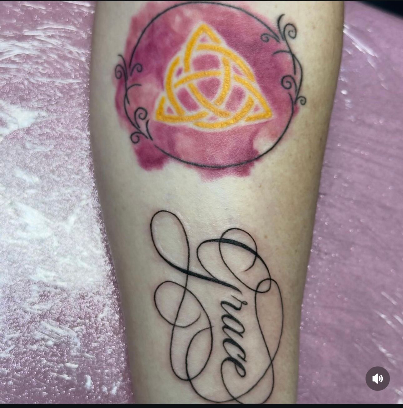 A tattoo on a person 's arm that says grace