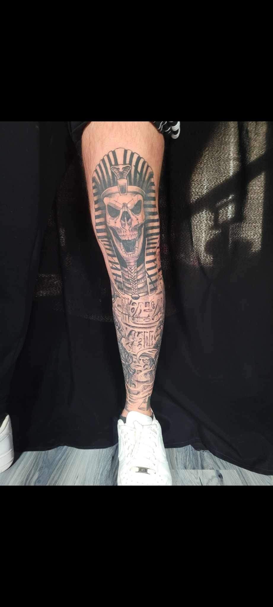 A close up of a person 's leg with a tattoo on it.