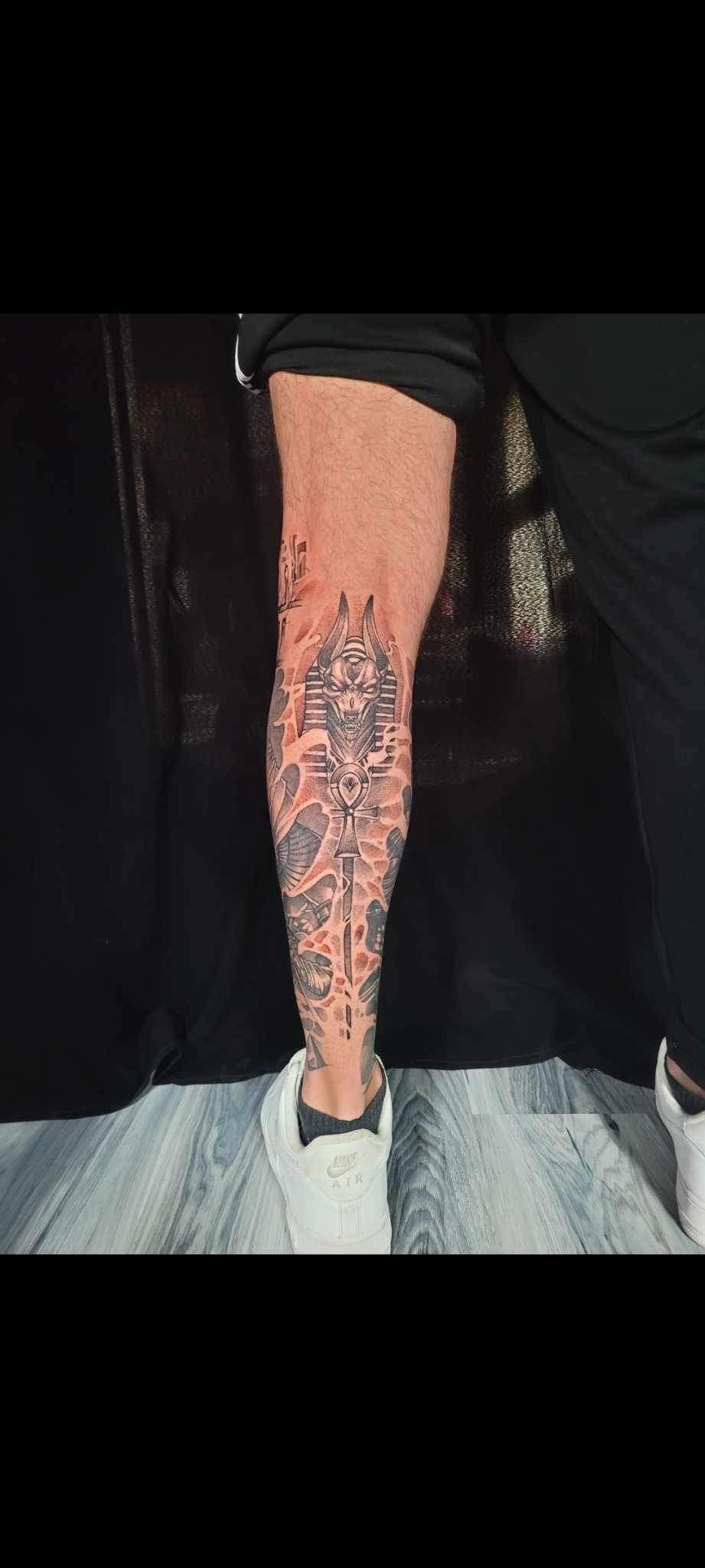 A close up of a person 's leg with a tattoo on it.