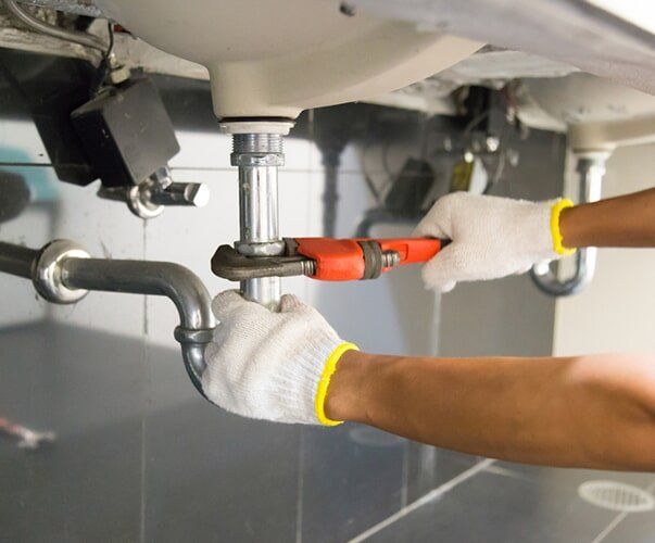 Plumber Fixing Sink Pipe — Plumbing Canberra, ACT