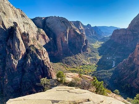 A view of a canyon from the top of a mountain.