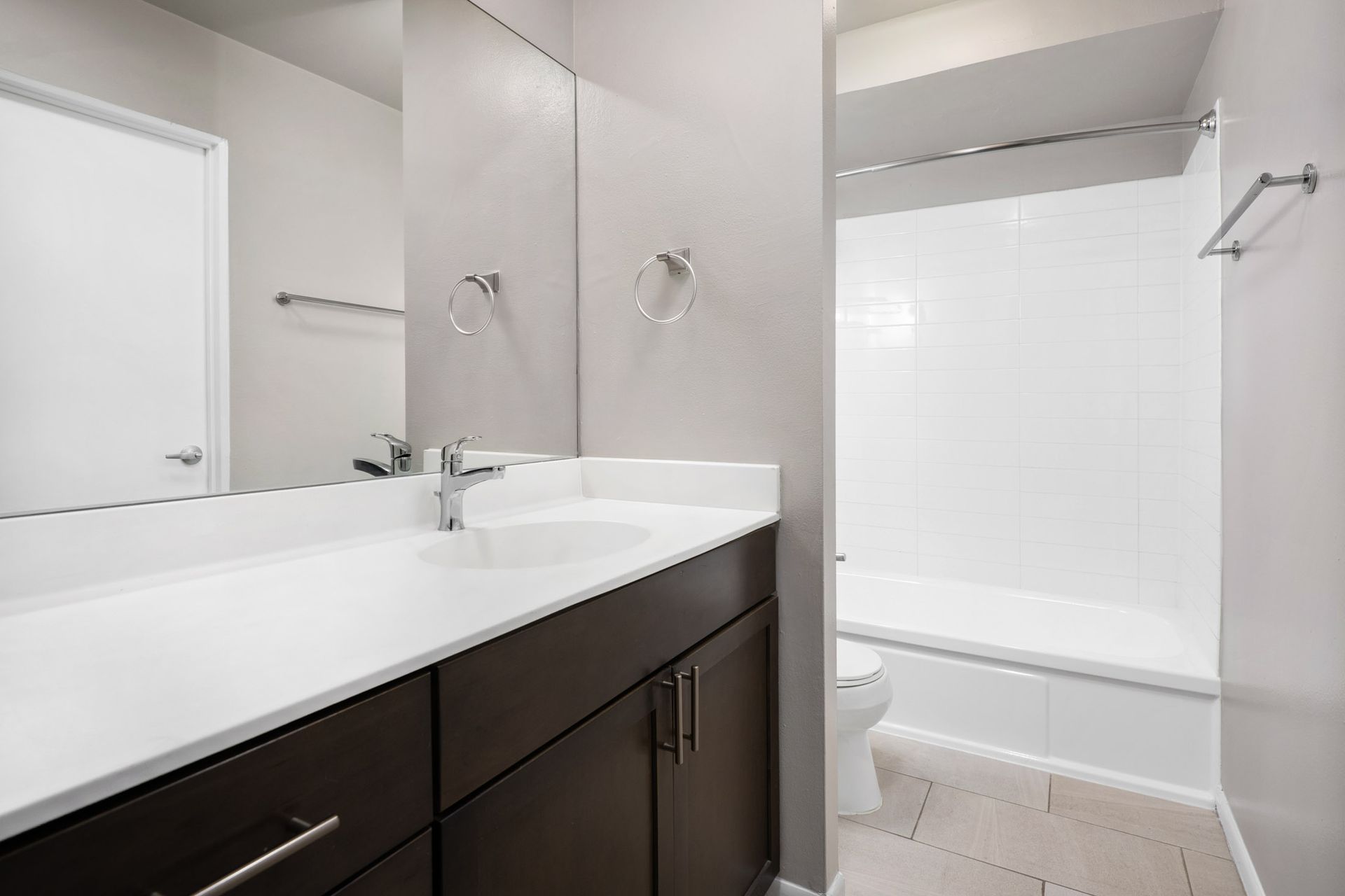 A bathroom with a sink , toilet , and bathtub at Reside on North Park.