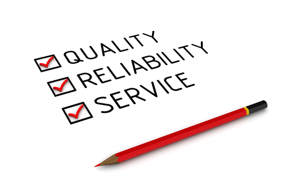 A red pencil is sitting next to a checklist that says quality reliability and service.