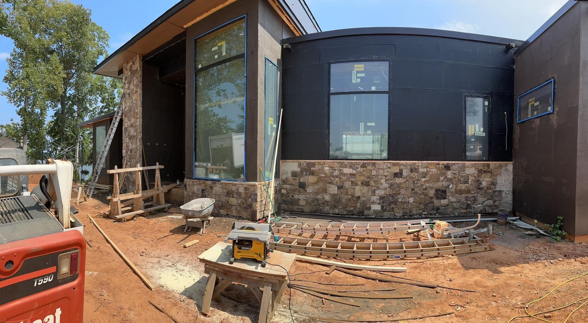 Under Construction house, color black with wall stone installation