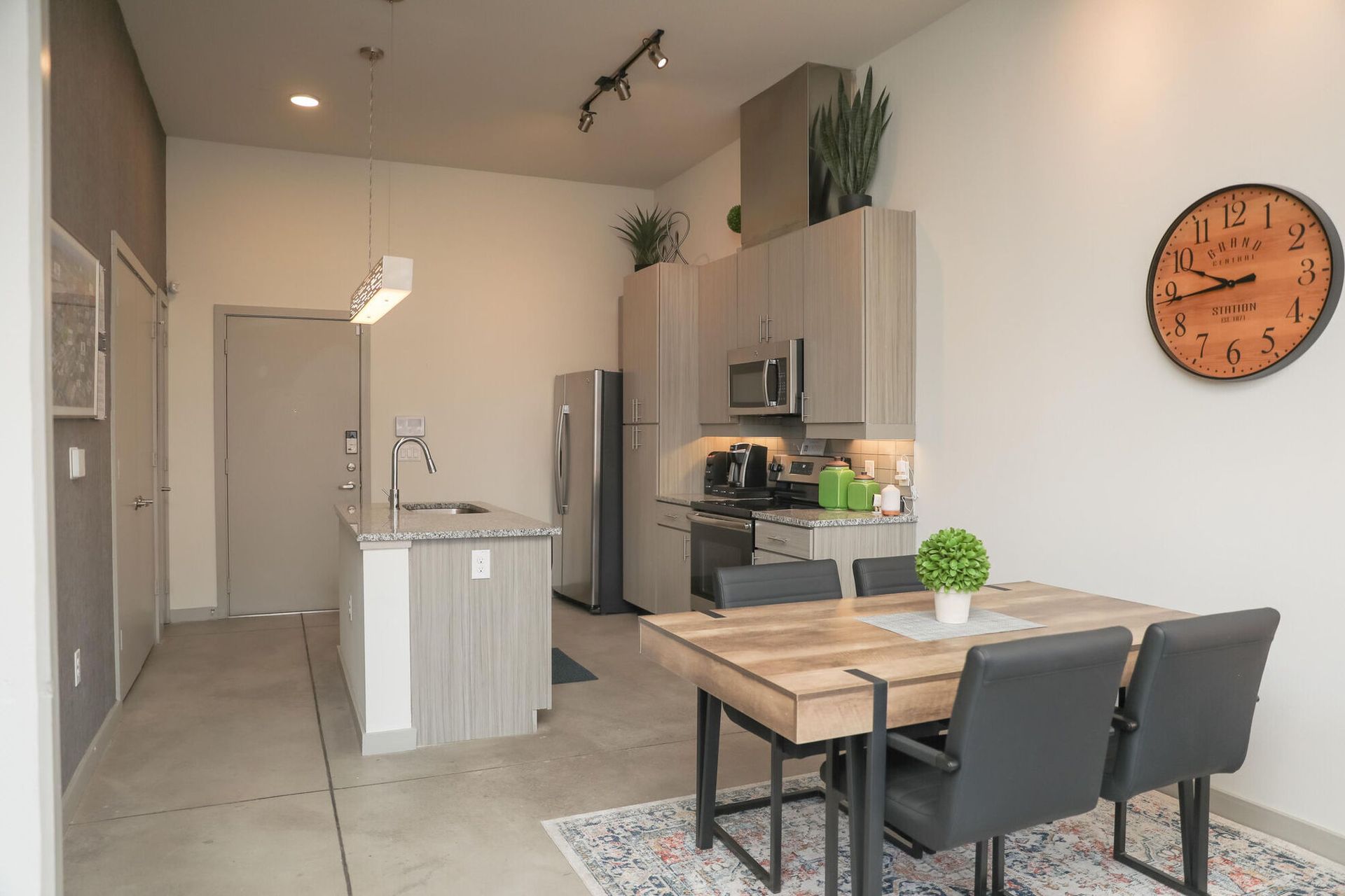 Modern kitchen and dining area of an apartment unit