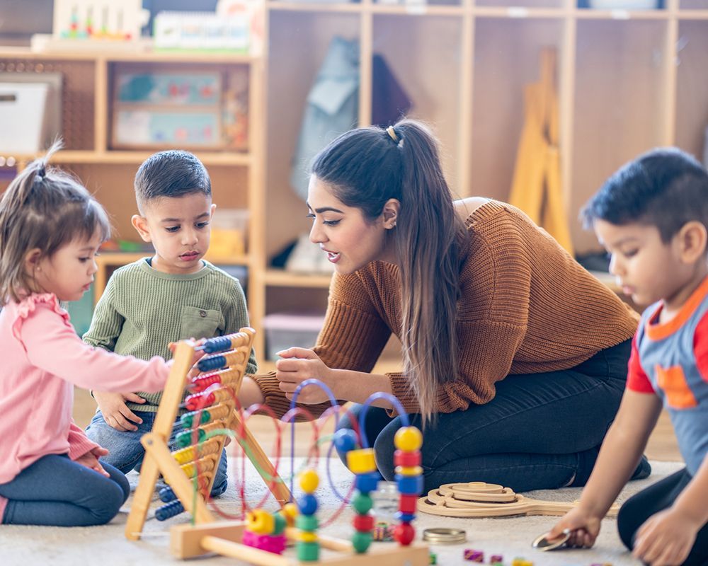 Children engaging in learning activities and play at a high-quality child care center in Dyer, IN, fostering early development.