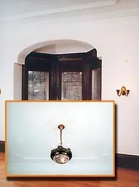 A picture of a ceiling fan in an empty room