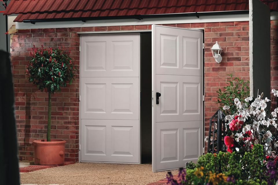 Side hinged garage doors