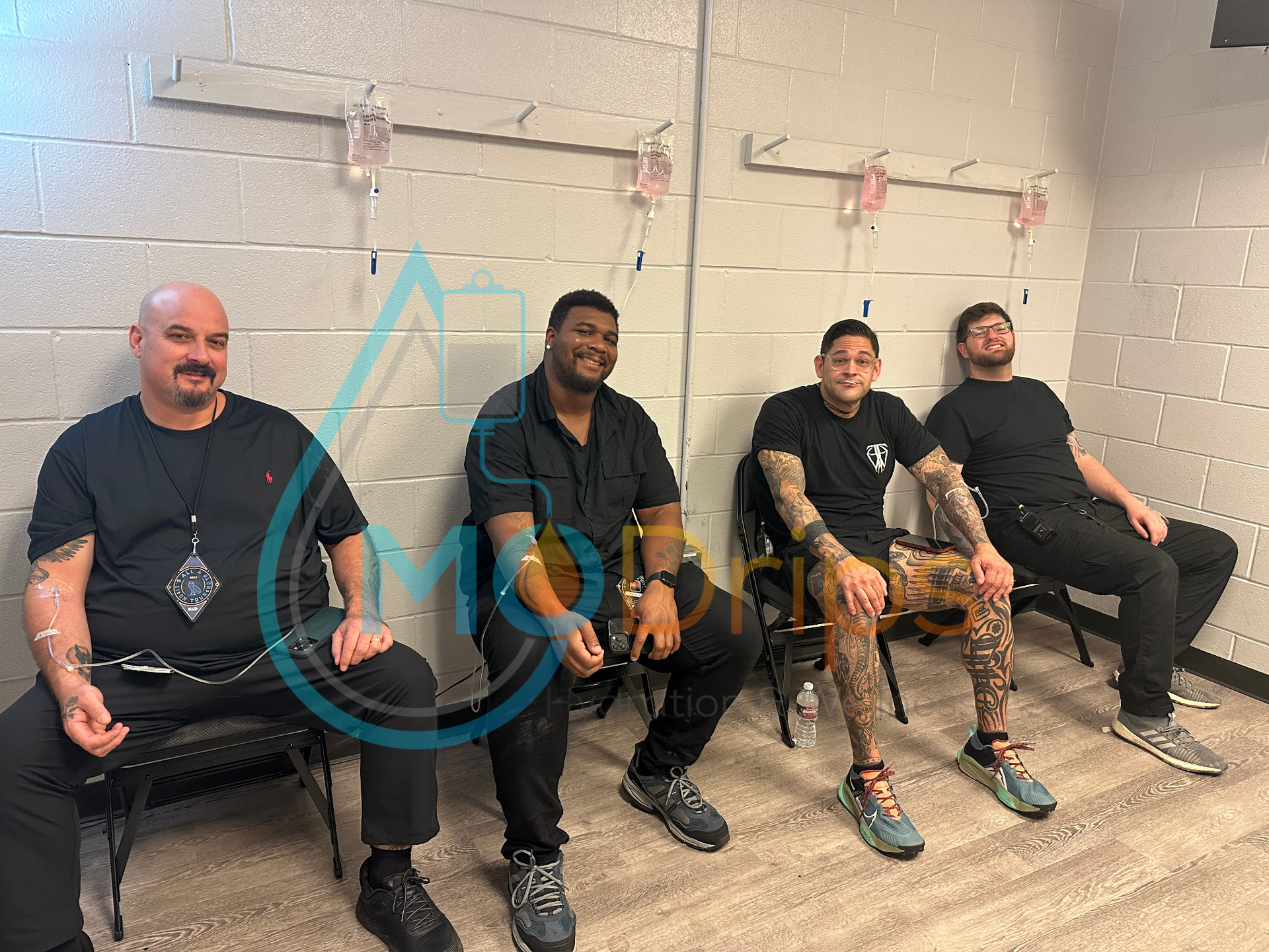 A group of men are sitting in chairs in a room.