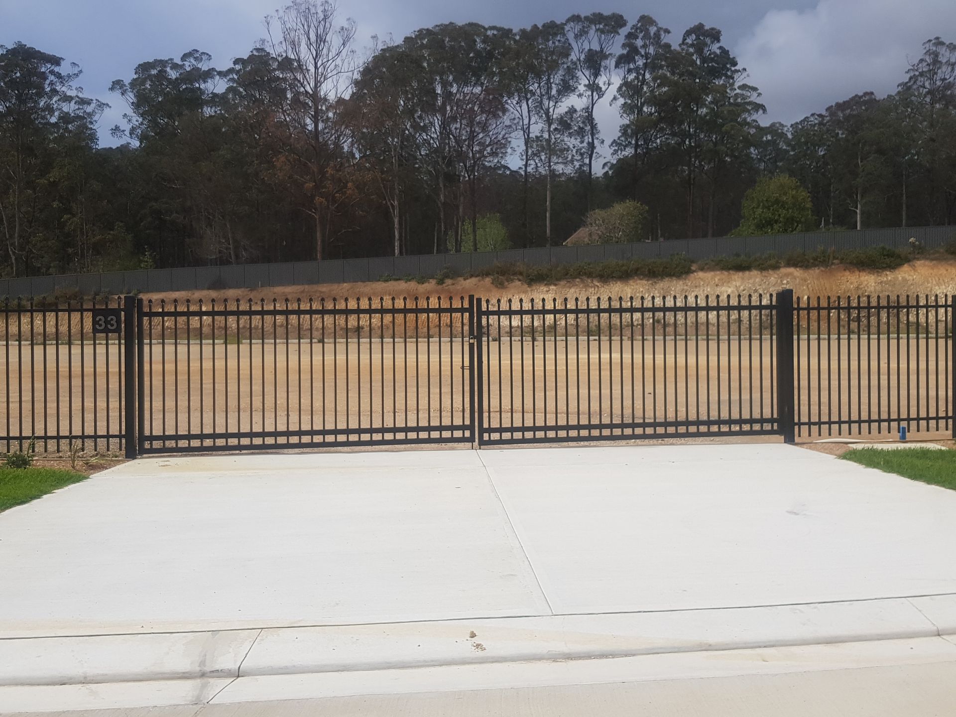 A Wooden Deck With A Metal Railing And A Pool In The Background — Australian Advanced Fencing In Wauchope, NSW