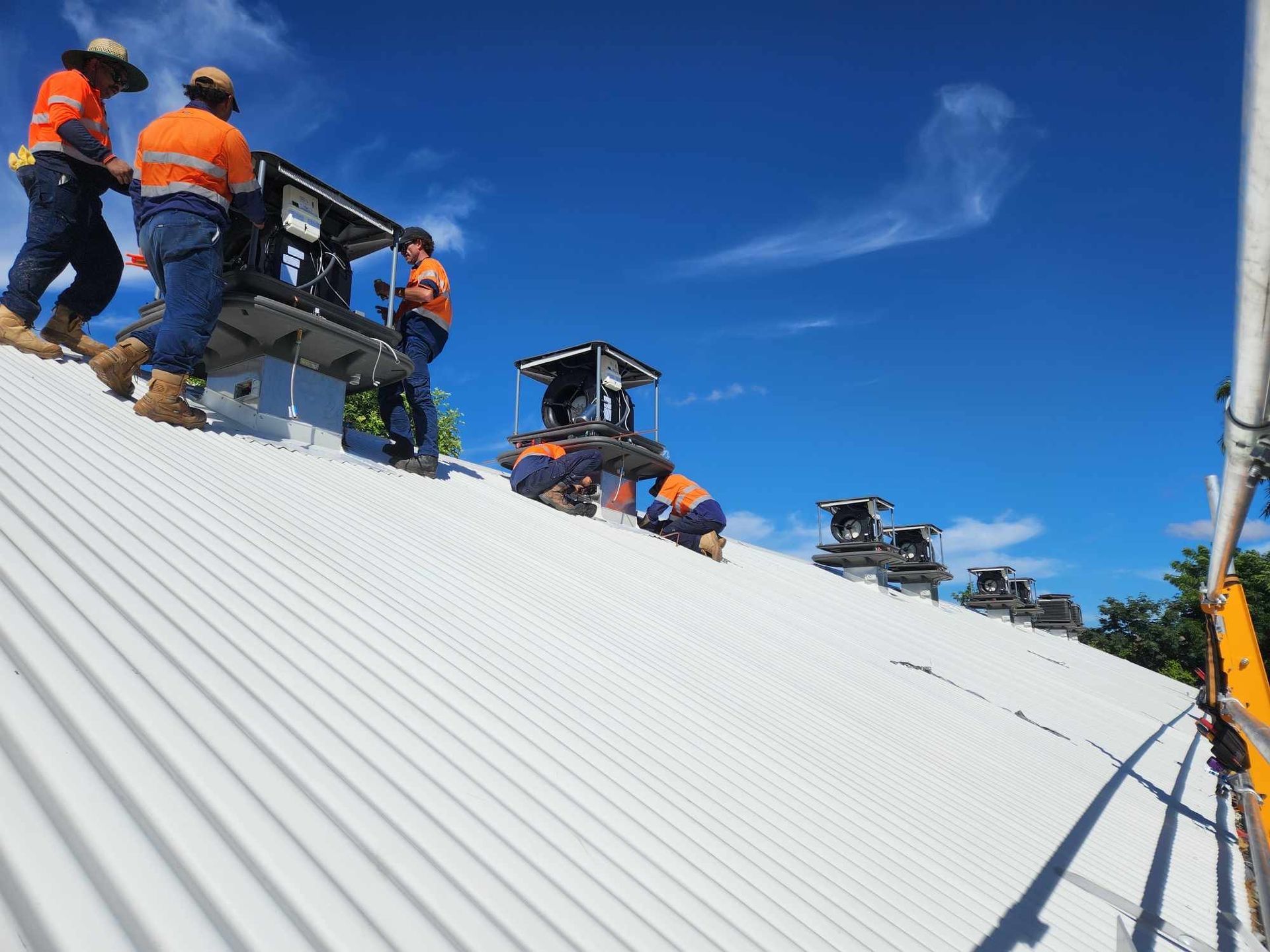 FVS Airconditioning workers on roof