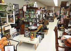 Retro home decor pieces and odd treasures styled in a welcoming shop display.