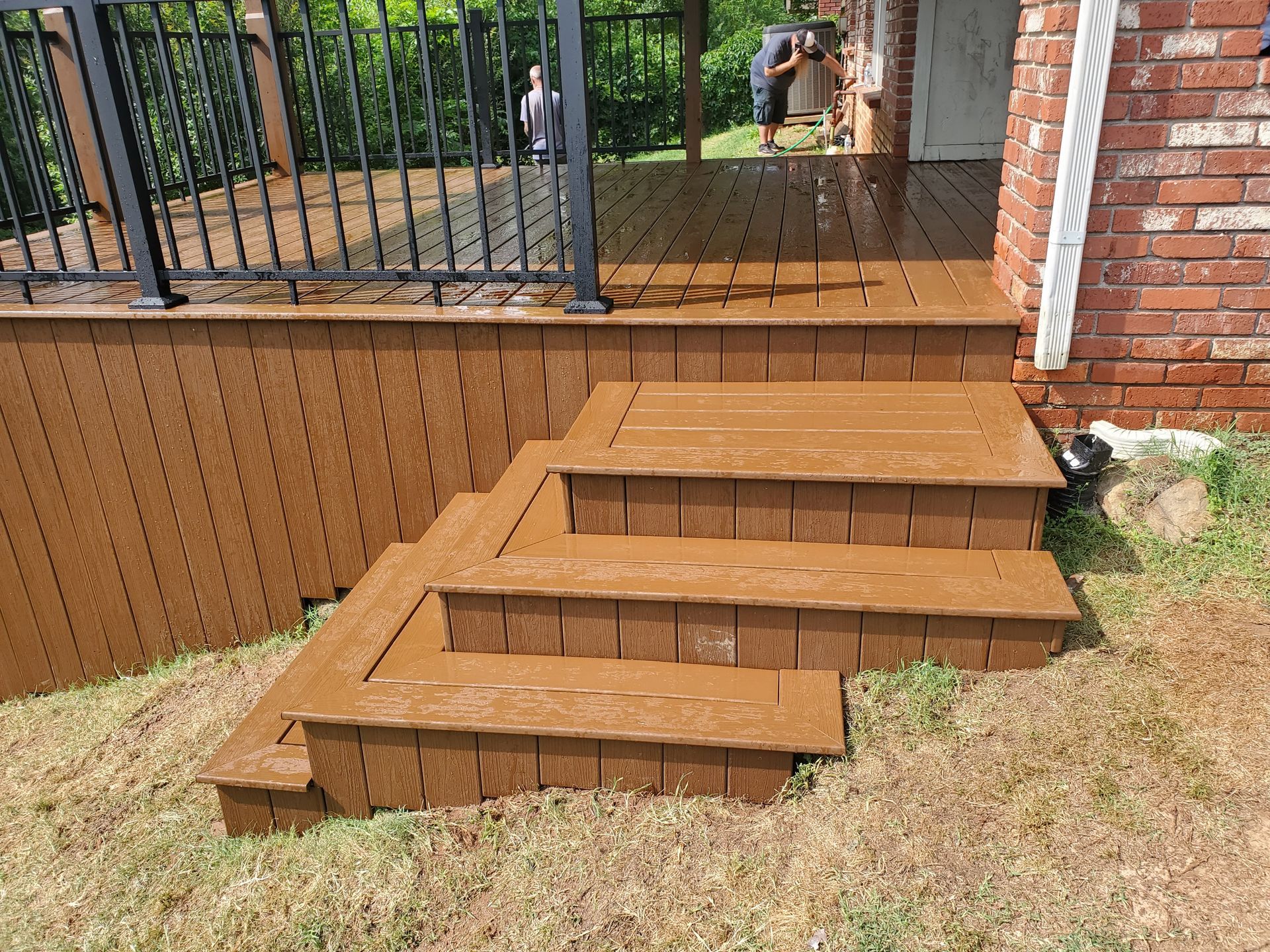 A wooden deck with stairs leading up to it.