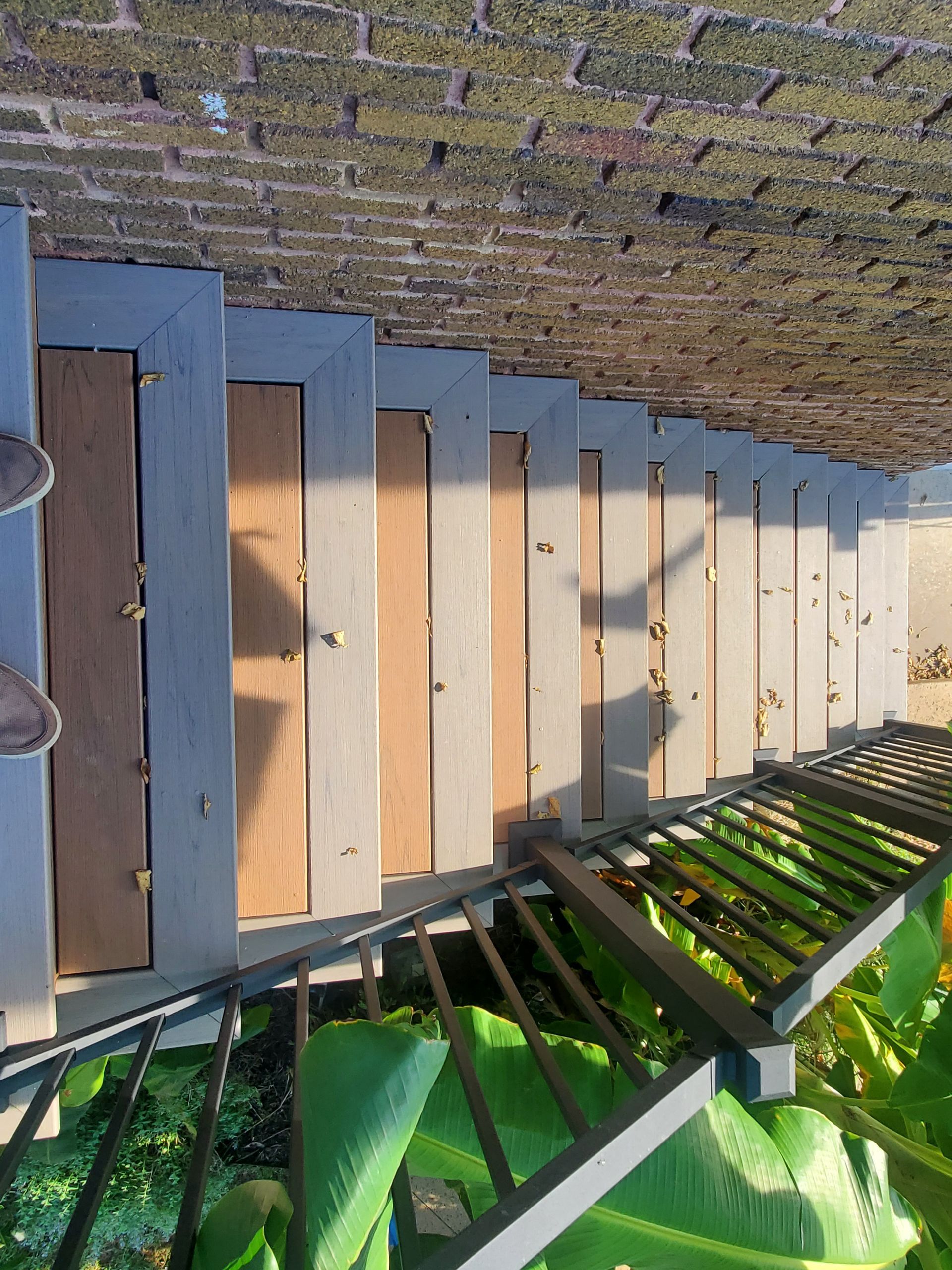 A set of stairs leading up to a brick wall