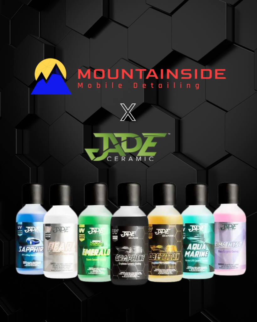 A row of bottles are lined up in front of a mountainside logo