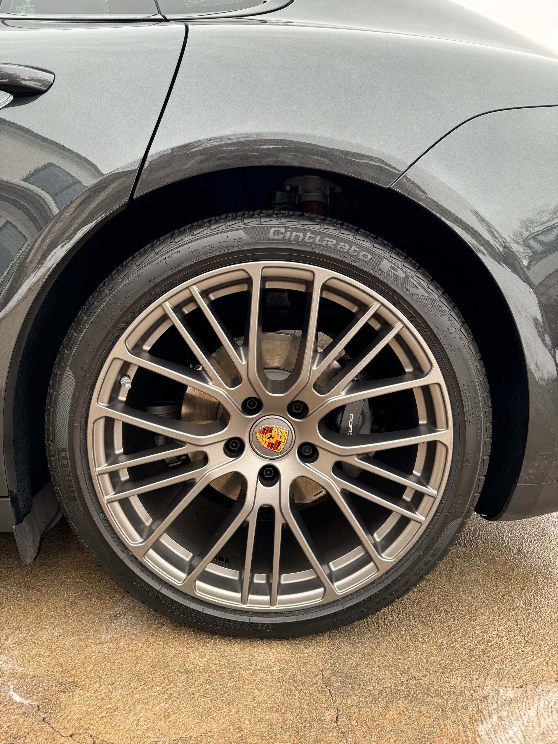 A close up of a car wheel with a tire on it.