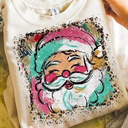 Sweatshirt with colorful Santa face design, pink, teal, white, and black brushstrokes.