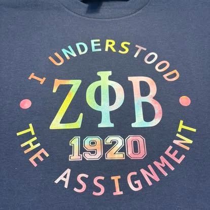Navy t-shirt with rainbow text: