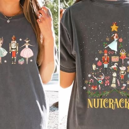 Gray t-shirt with Nutcracker characters. Front has a row of figures. Back has a Christmas tree design with Nutcracker elements.