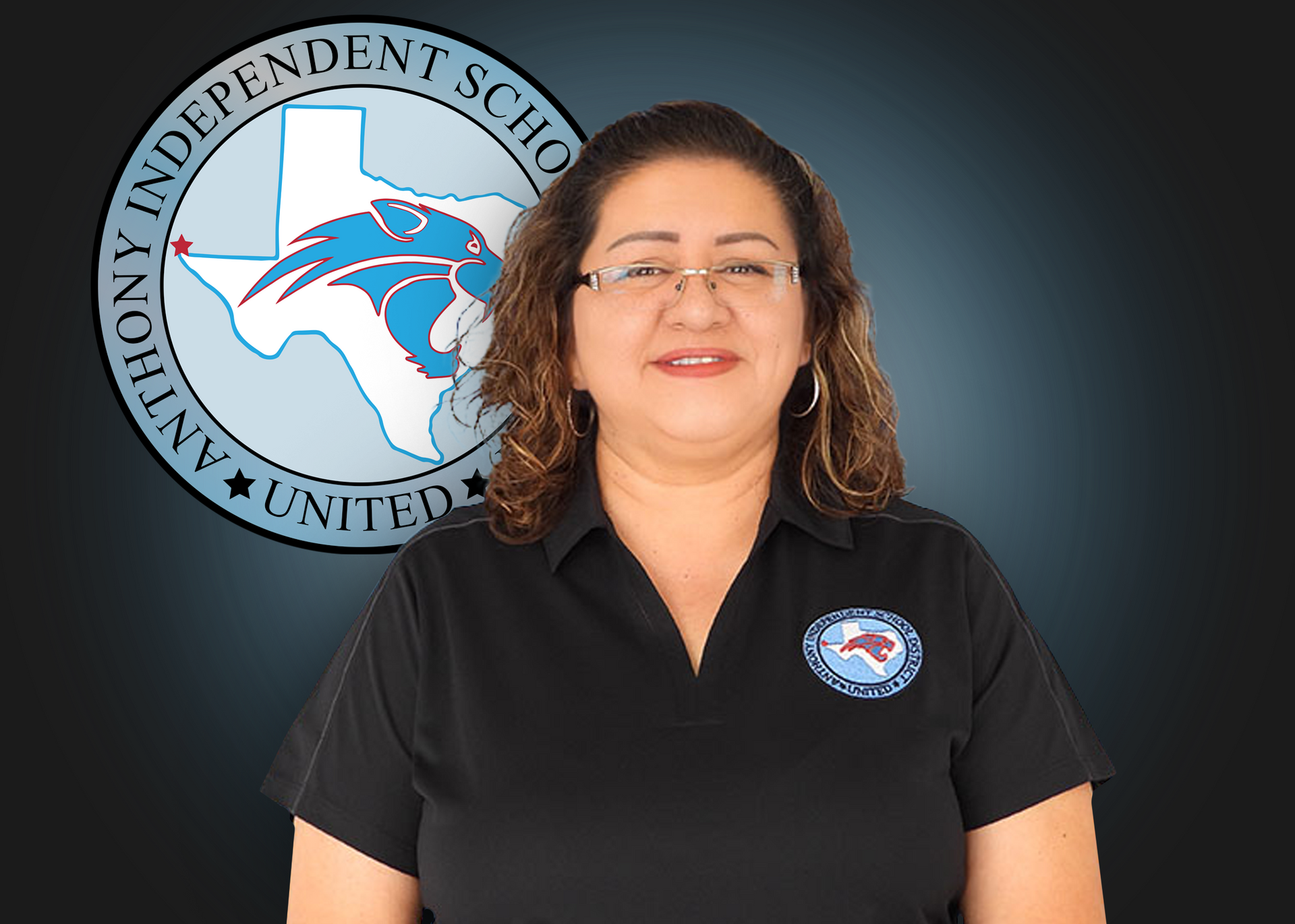 A woman is standing in front of an independent school district logo