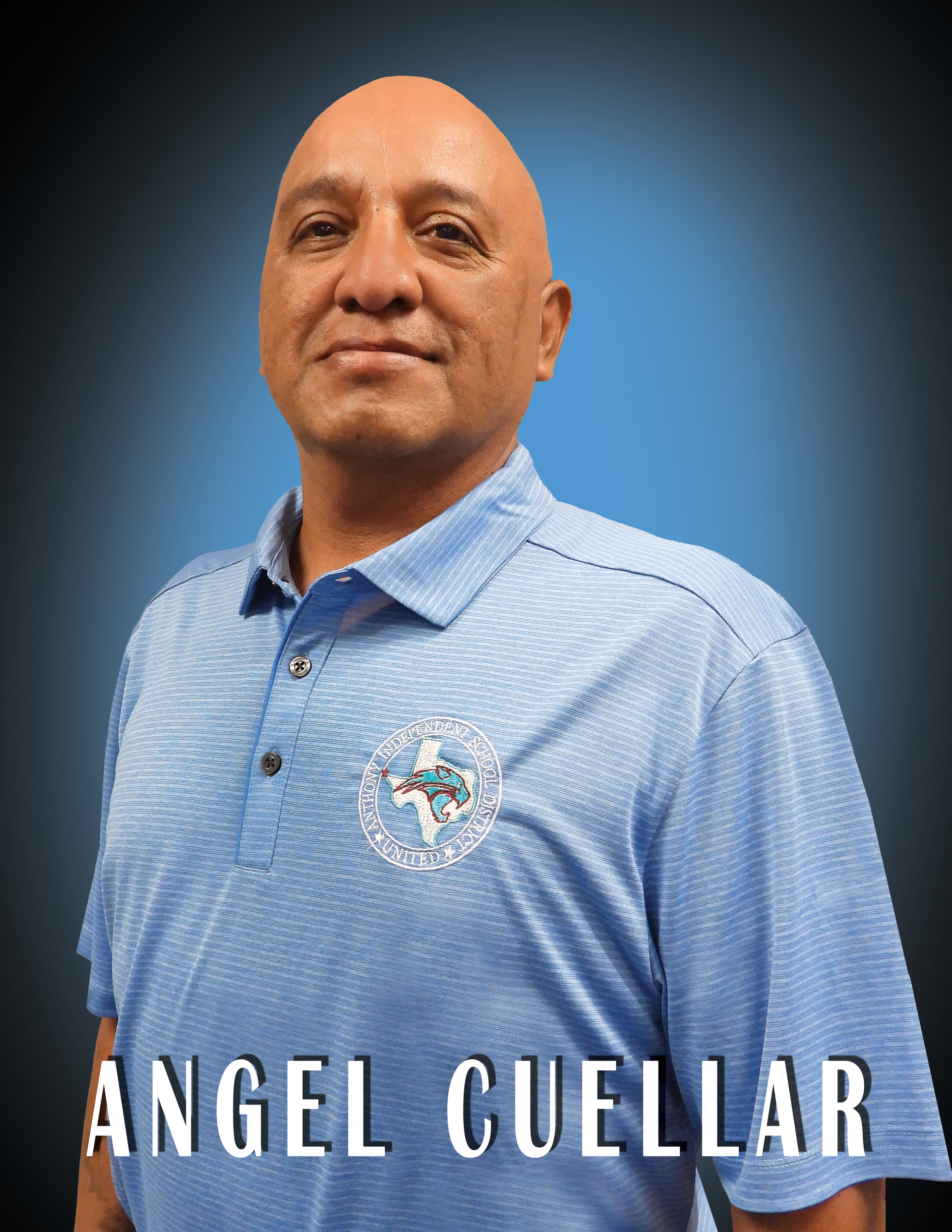 Board President Angel Cuellar wearing a blue shirt standing in front of a blue background.