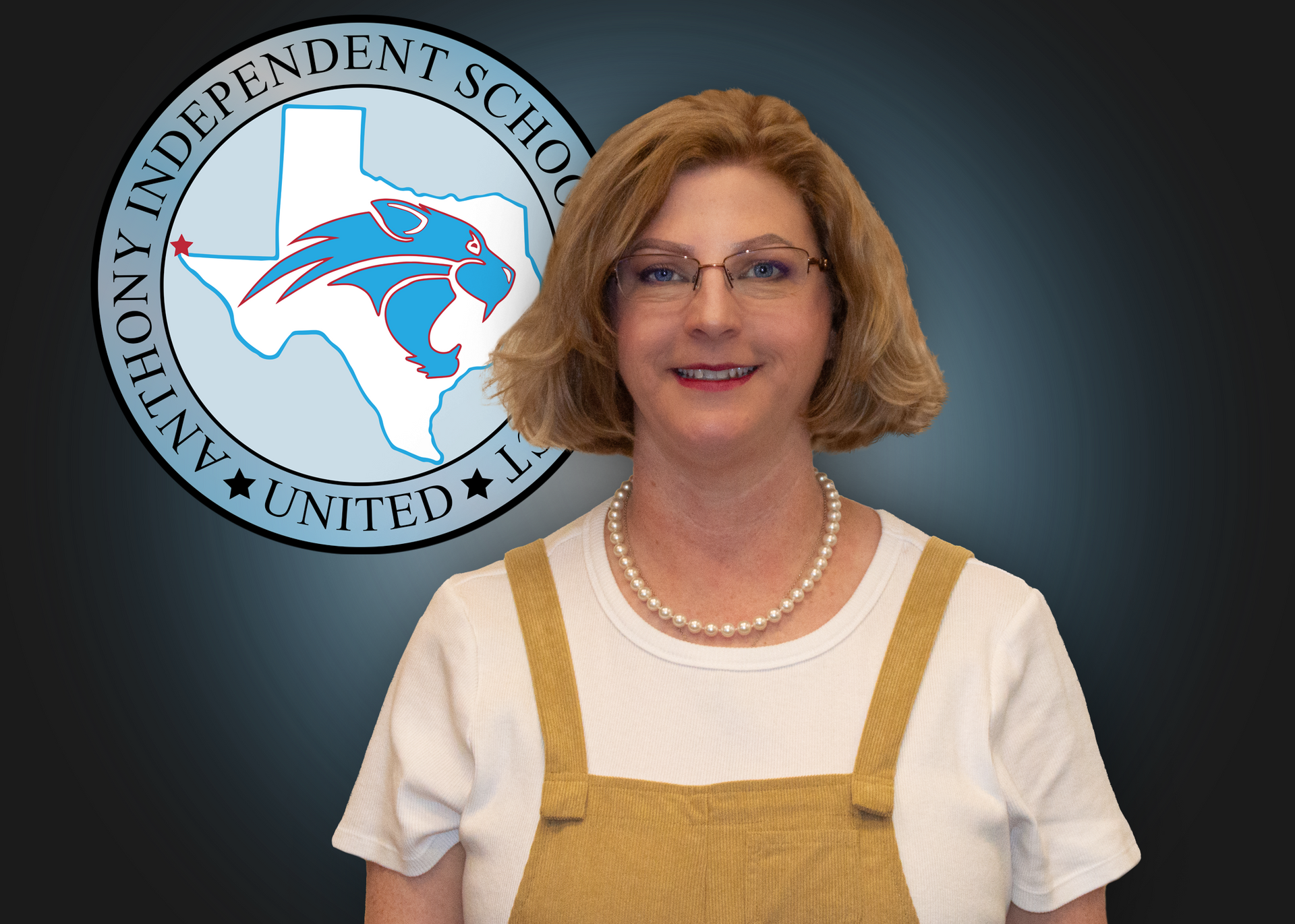 A woman stands in front of an anthony independent school logo