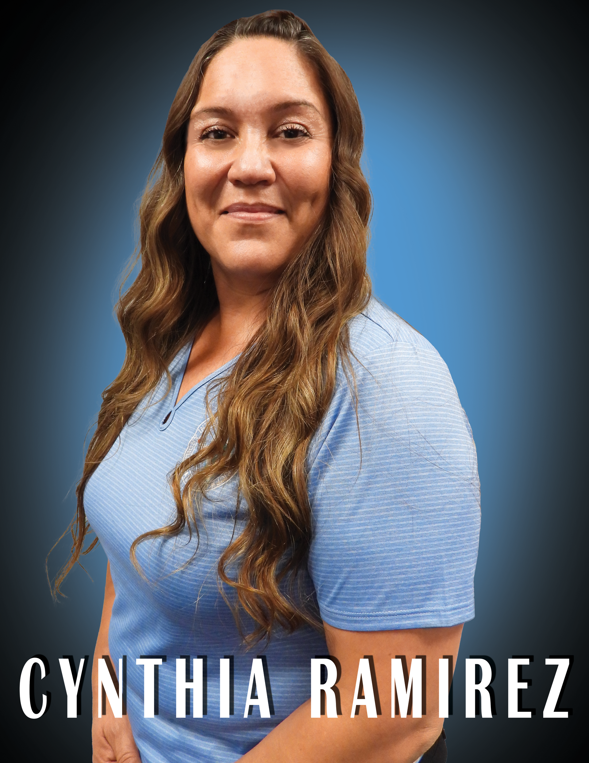 Vice President Cynthia Ramirez wearing a blue shirt standing in front of a blue background.