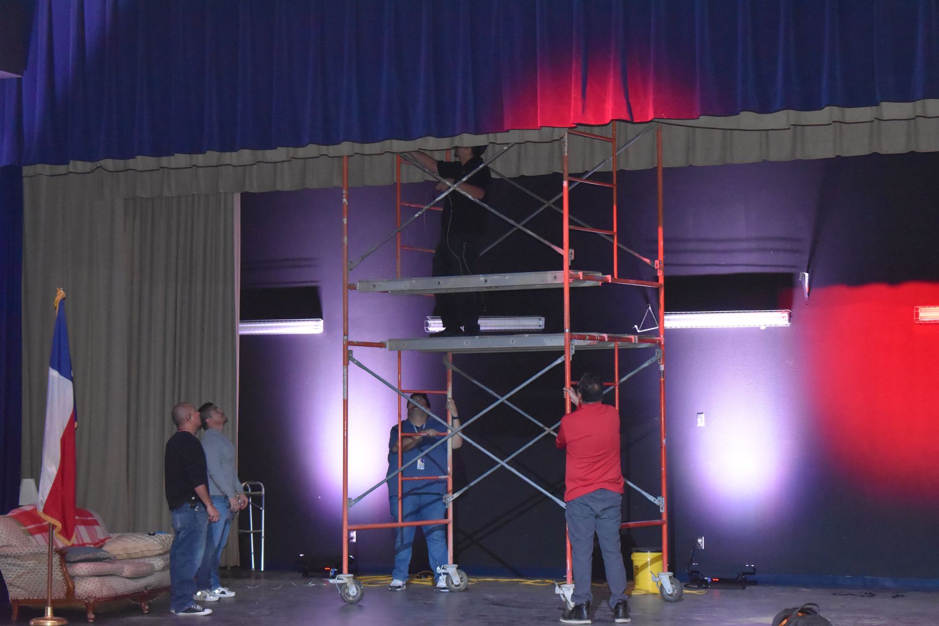 Crew installs theater lights