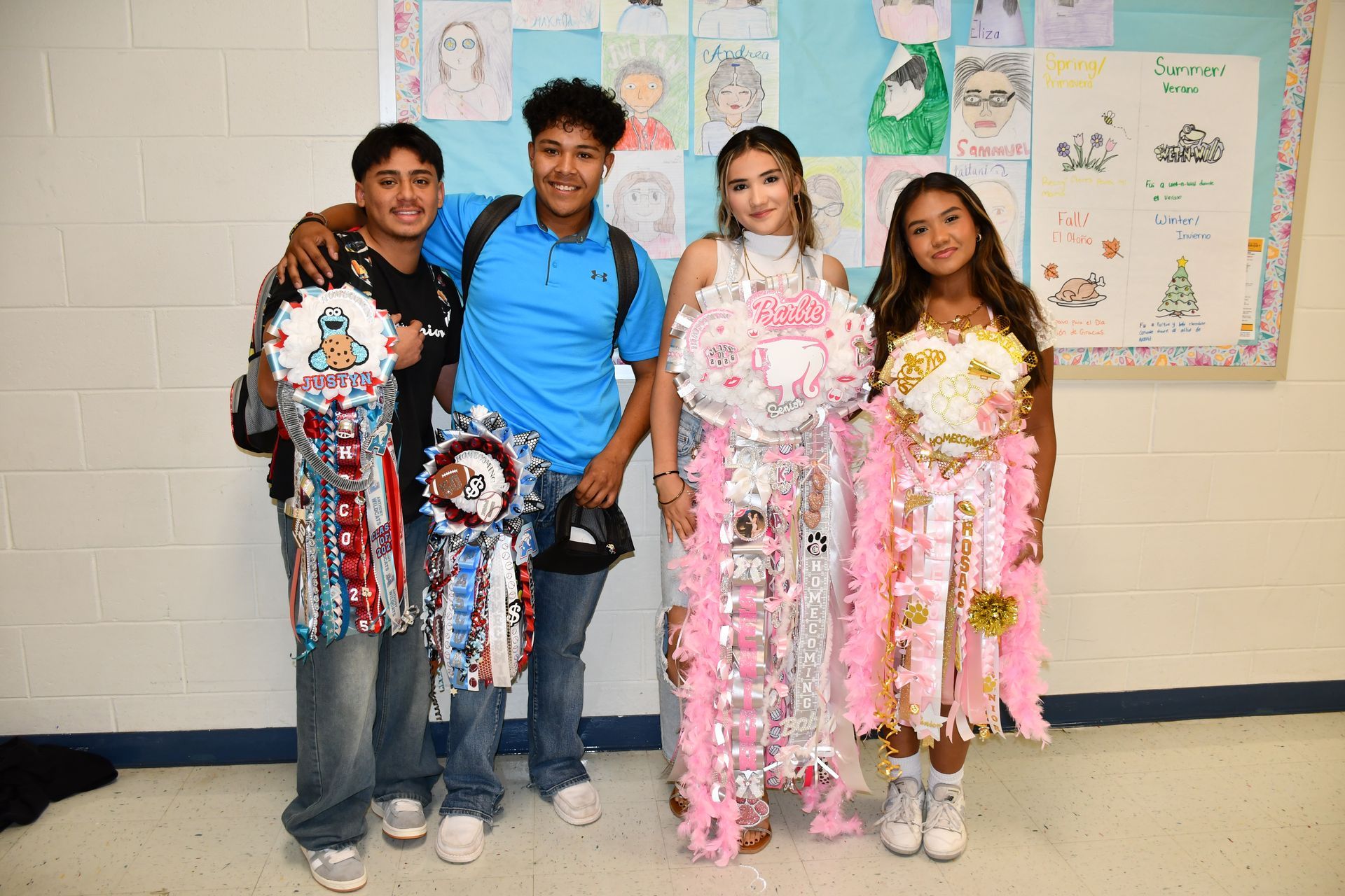 Students stand in a line while wearing mums