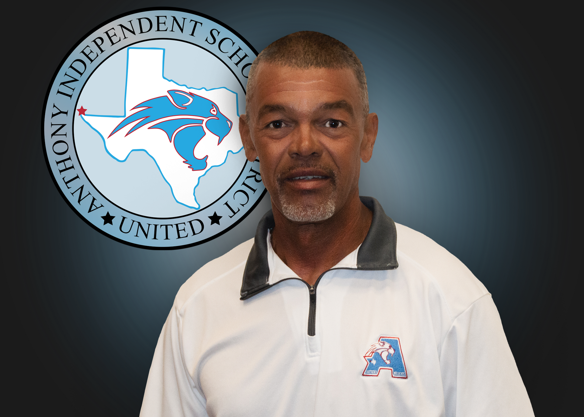 A man stands in front of an independent school logo