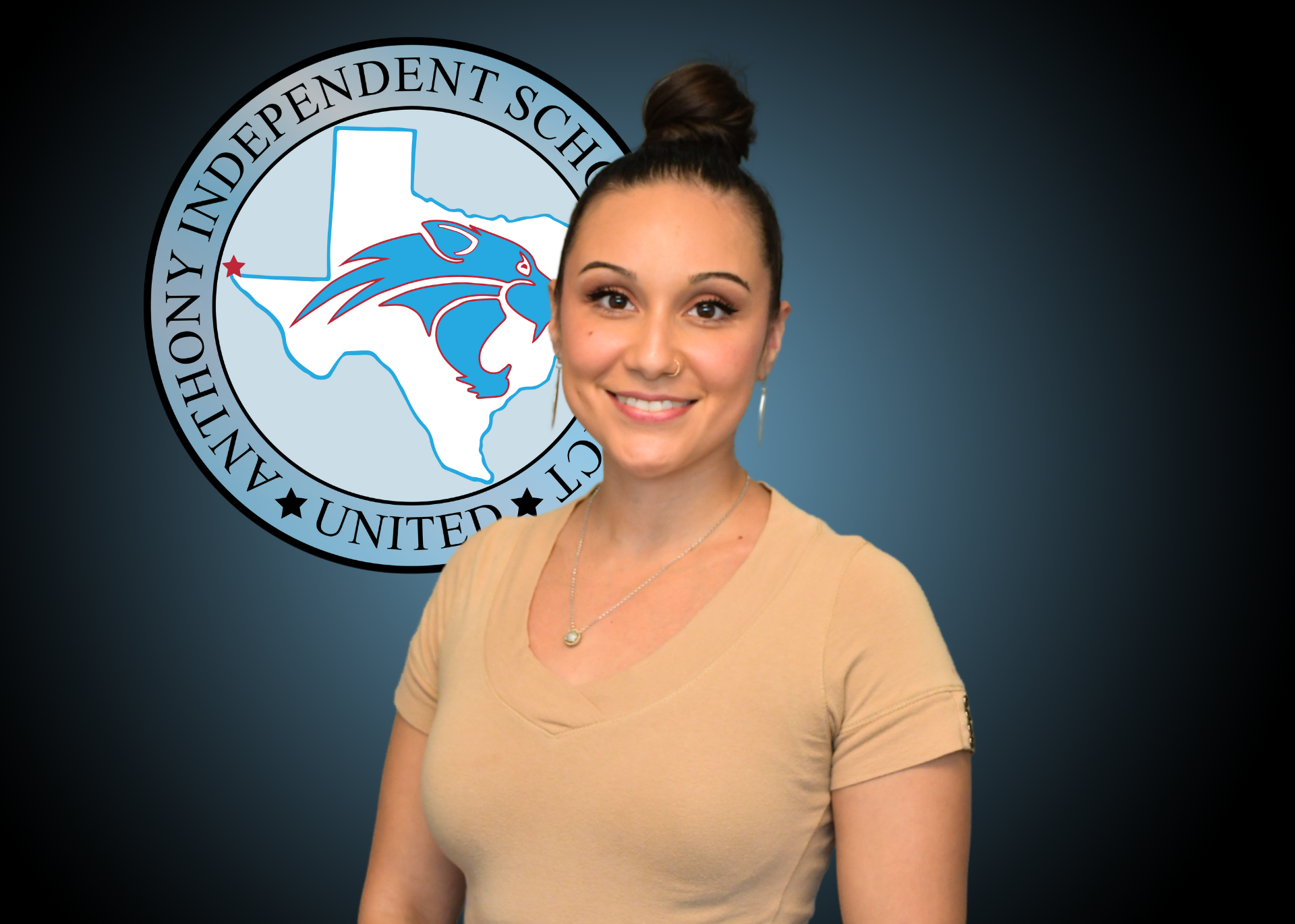 A woman in a blue shirt is standing in front of an independent school logo.