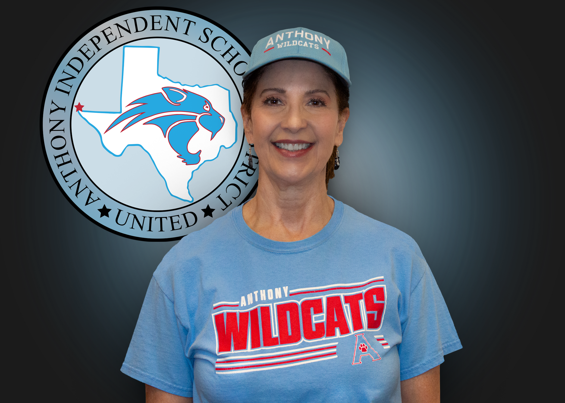 A woman wearing a blue shirt that says wildcats
