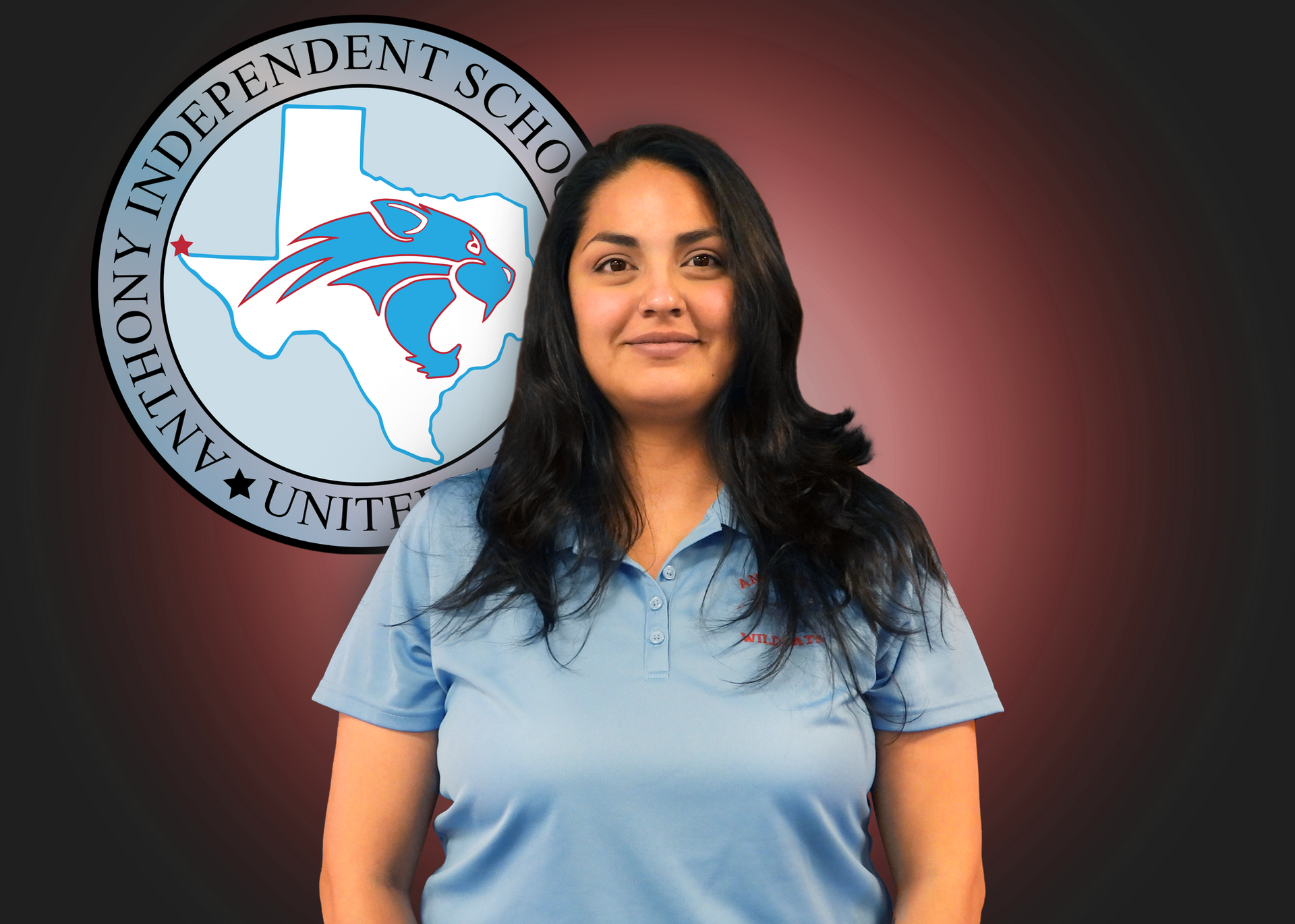 A woman is standing in front of a logo for anthony independent school