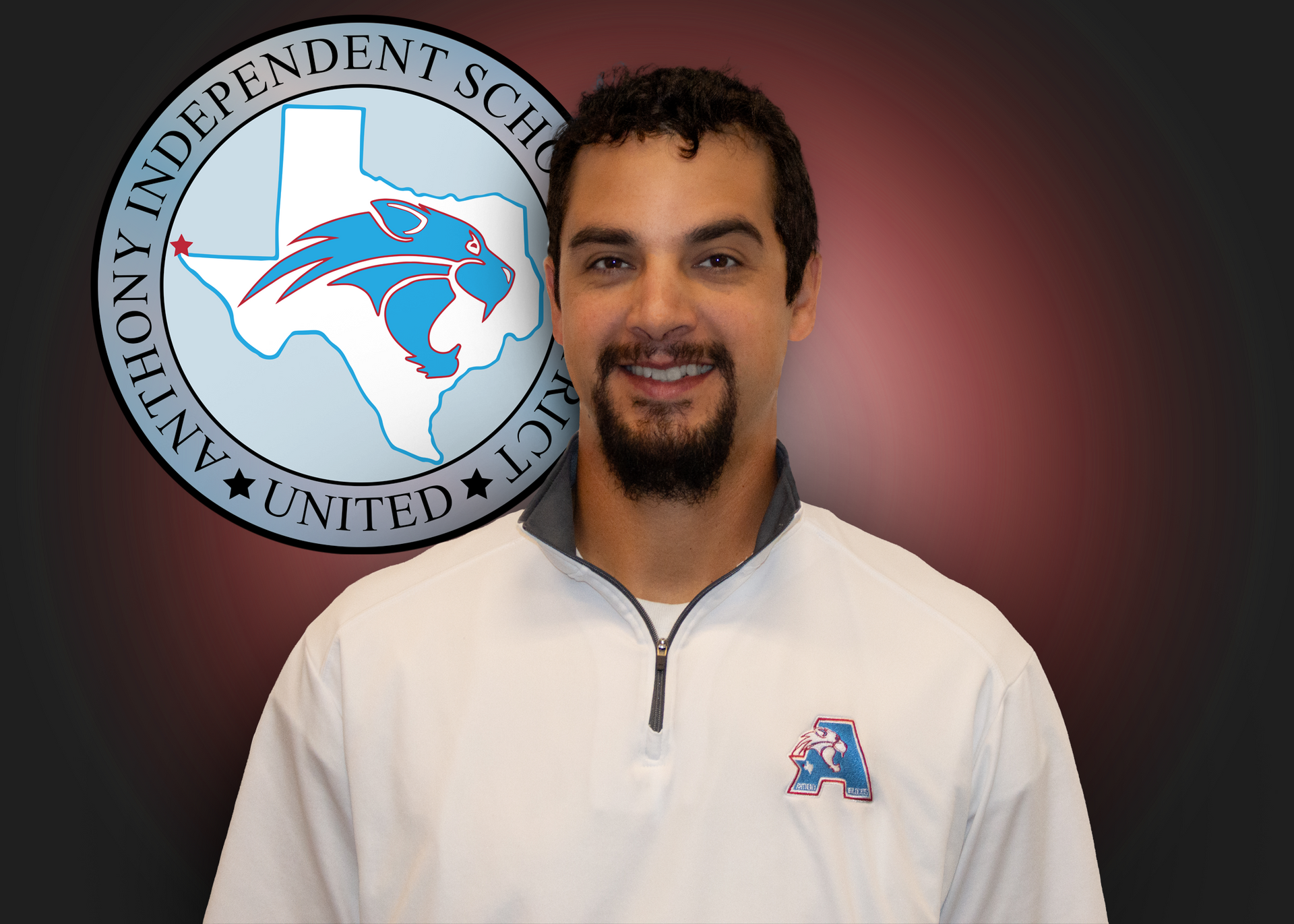 A man is standing in front of an independent school logo