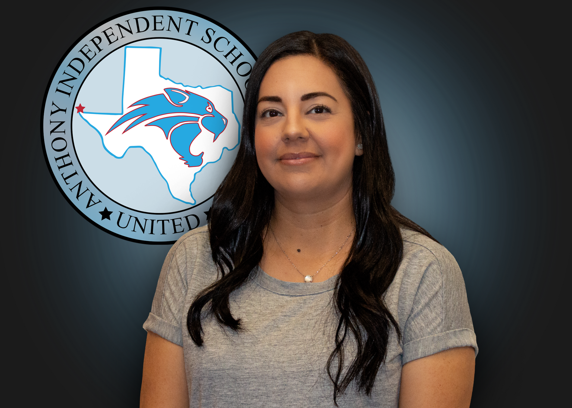 A woman is standing in front of an independent school logo.