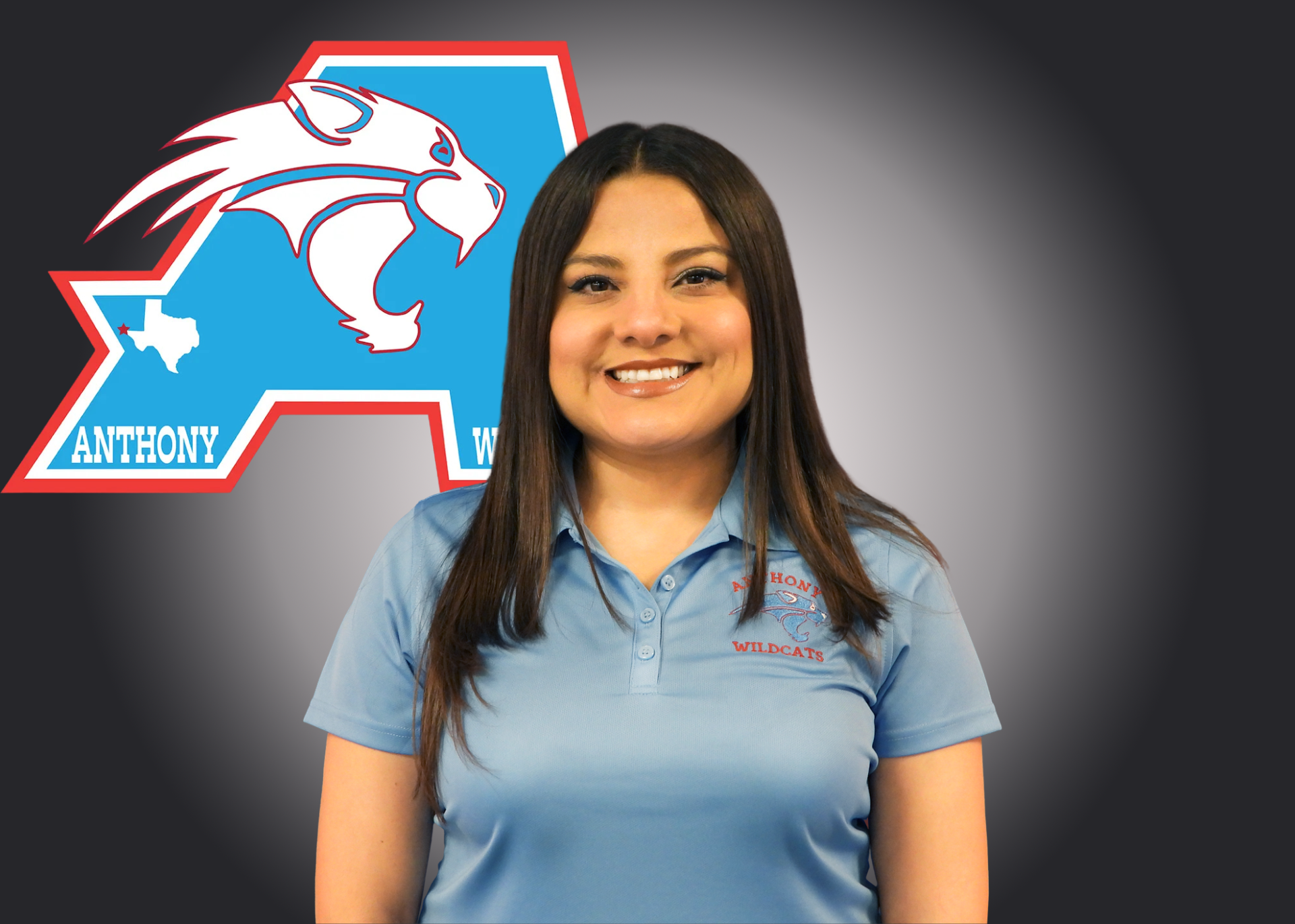 Woman stands in front of Anthony Athletics logo