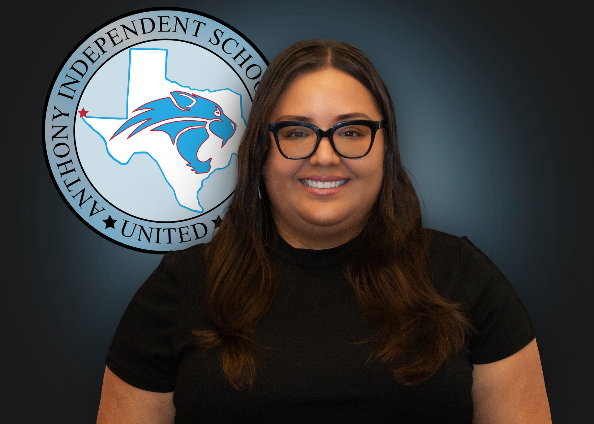 A woman wearing glasses is smiling in front of an independent school logo.