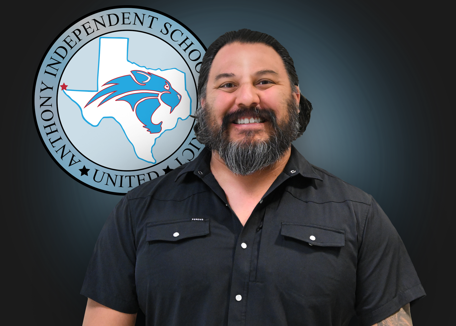 A man with a beard is smiling in front of a logo for anthony independent school