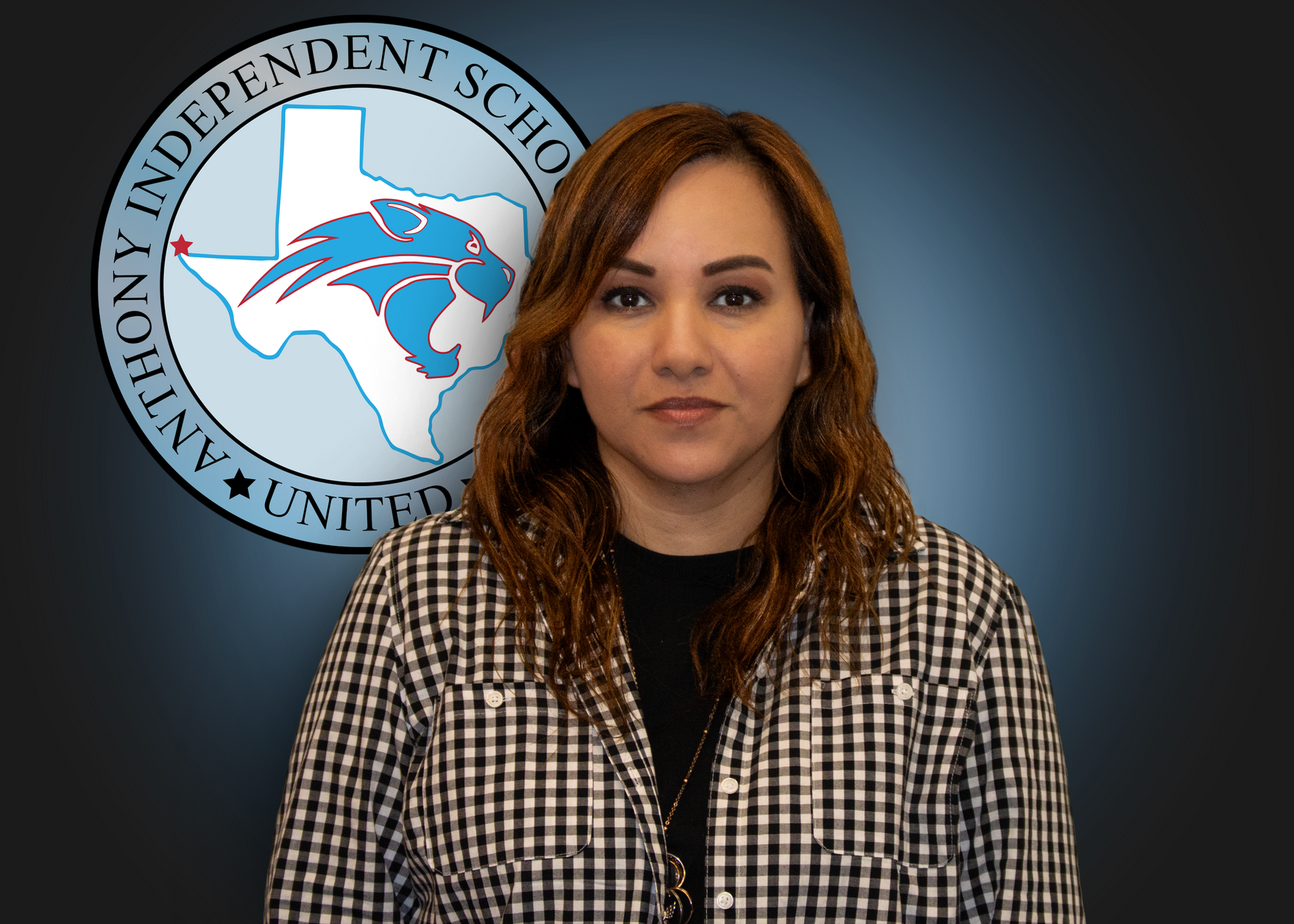 A woman is standing in front of an anthony independent school logo