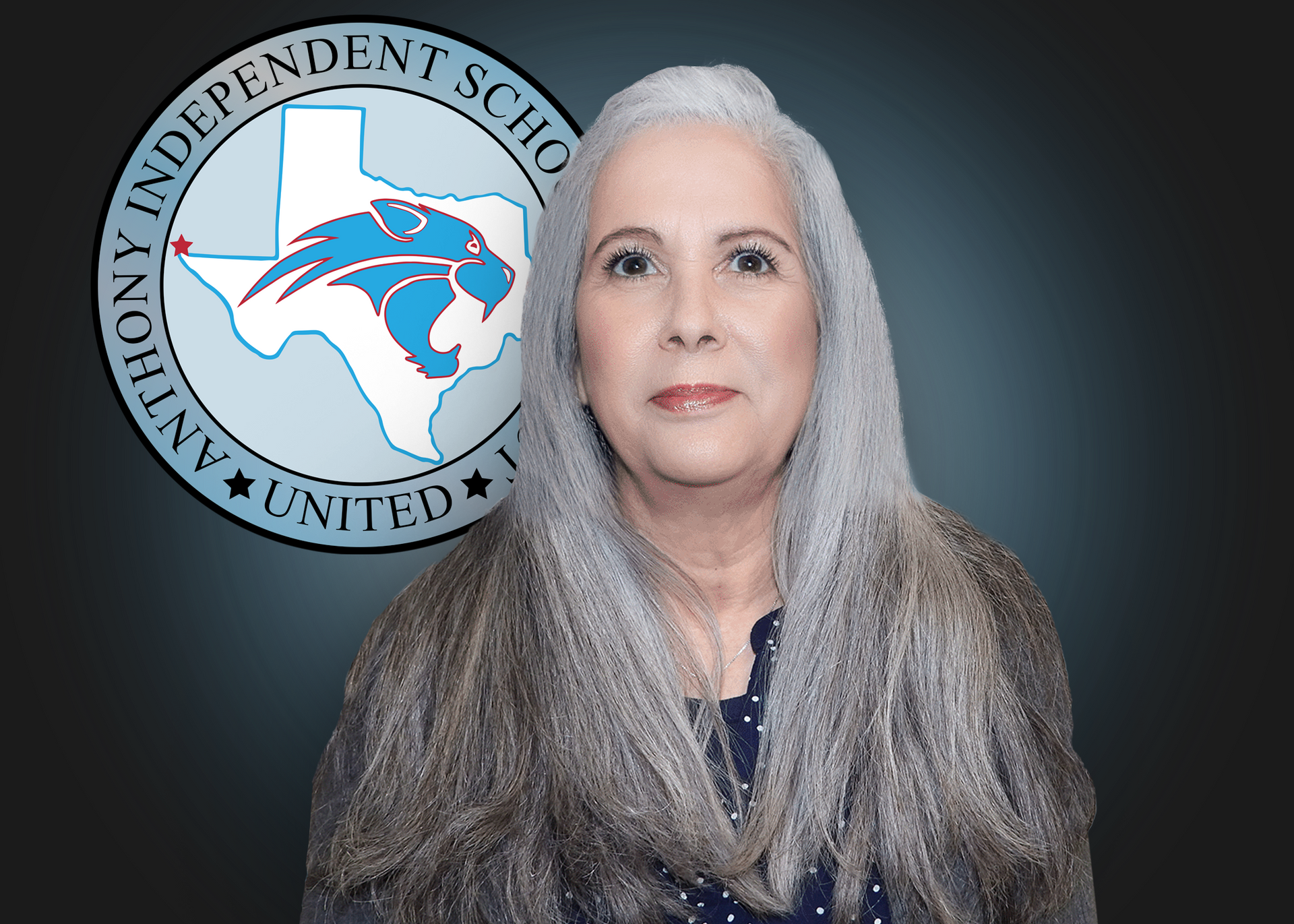 A woman with gray hair is standing in front of an independent school logo.