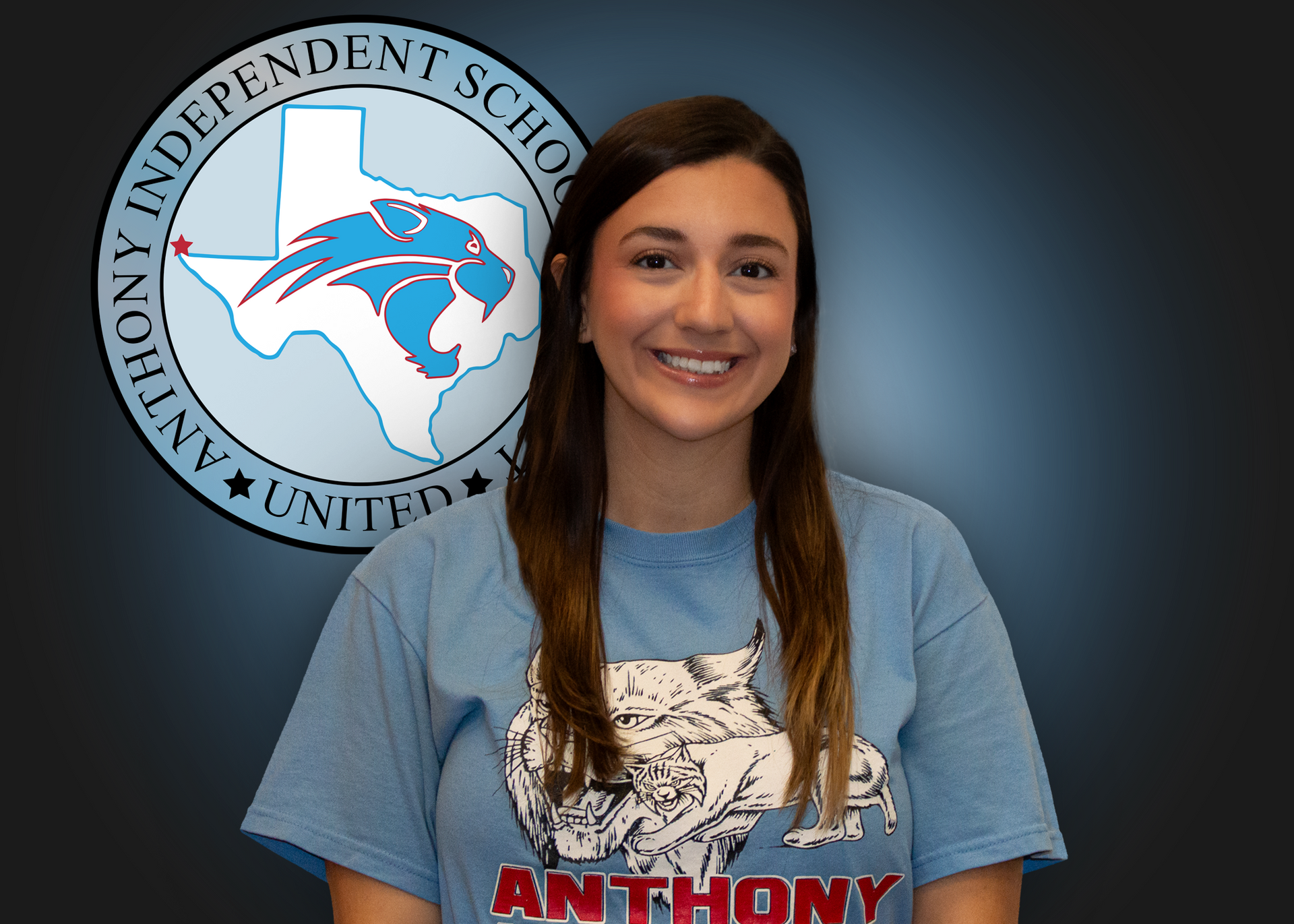Woman stands in front of Anthony ISD logo